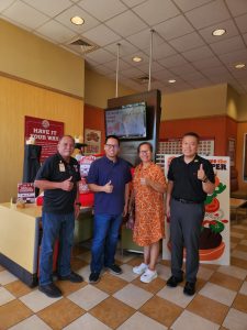 Coca-Cola and Burger King “Win for the Holidays” promo winner William Ayson (second left) and his mother, Imelda Ayson give a thumbs up at the awarding of prizes held at the Burger King Tumon Bay location on Jan. 19, 2024. Presenting the prizes are Burger King General Manager Rudy Rodolfo (right) and Jose Fernandez (left), sales manager of Coca-Cola Beverage Co. (Guam), Inc. William won a set of premium Coca-Cola merchandise including a pop-up tent, a custom bike and helmet, a cooler and two folding chairs.